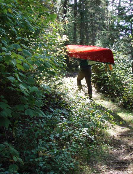 Steve portaging canoe